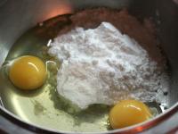 In a bowl beat the sugar with eggs until foamy....