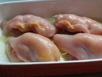Place stuffed breasts on the greased baking pan....