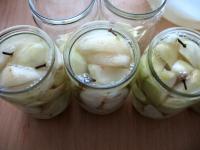 Pour brine made of water and sugar onto pears. We...