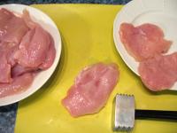 Slit chicken breasts into halves and lightly pound...