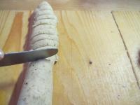Make a roller from the dough, cut it into equal...