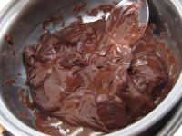 Melt the chocolate and spread a portion in a thin...