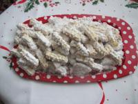 Coat still warm coconut bites with the mixture of...