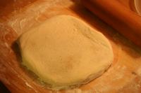 Roll out the dough until the pork rinds show up in...