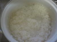 Rinse the rice under the running water through the...