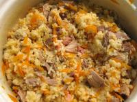 Add meat, carrot with bacon into the rice. Gently...