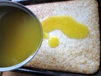 Pour orange-custard topping over the cake, after...
