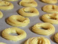 Pipe the dough through the pastry bag onto the...