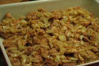 Put the meat to a baking dish and fry the onion in...
