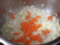 Cook chopped onion and carrot in oil over...