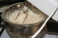 Whisk egg with sugar in a bowl placed over a pan...