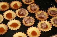Fill the tartlets with the prepared cream to the...