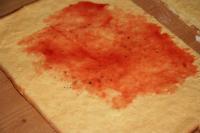 Spread the jam over the baked dough. Cover it with...