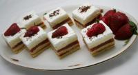 Cut the cake into pieces and decorate with grated...