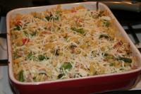 Bake in preheated oven. Sprinkle with cheese after...