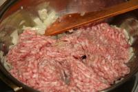 Fry the finely chopped onion and garlic on a...