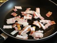 Cut the bacon into thin strips and fry it on the...