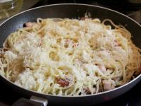 Add cooked spaghetti and finely grated cheese...