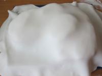 Roll out confectionery fondant on board dusted...