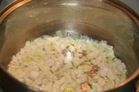 Cook in oil finely chopped onion until it becomes...