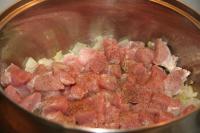 Add meat cut into pieces, sprinkle with ground...