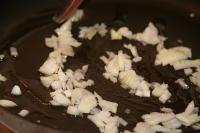 Cook finely chopped onion in a hot oil. ...