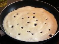 Pour half of the dough on the melted butter,...