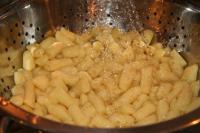 Cook potato gnocchi according to package...