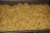Spread evenly the prepared gnocchi in small baking...