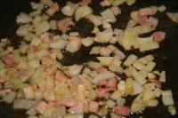 Take the scrolls out and cook finely chopped onion...