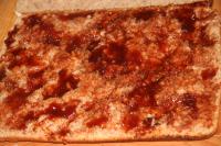 Spread one layer of the cool pastry with jam....