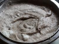 Pour beaten egg yolks into a bowl, slowly add...