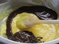Pour the slightly cooled chocolate in the butter...