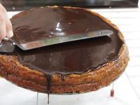 Spread chocolate topping over the cold cake and...