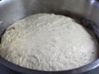 Pour water with yeast into the powdery mixture,...