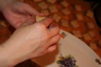 Spread cream on top of the pastry and stick every...