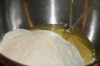 Put the powdered milk into a bowl and in parts...