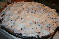 Carefully spoon whisked egg white equally over the...