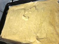Place parchment paper on a baking tin and spread...