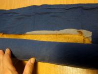 Place baked cake base on a wet dish towel and roll...