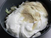 Cover the dip ingredients with yogurt, season with...