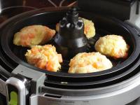 Shape the dough into meatballs with wet hands,...