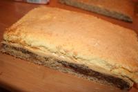 The bottom part of the cake is a nutty corpus on...