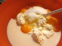 Stir well cream cheese, eggs, milk, and sugar. ...