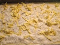 Coarsely grate butter on top of the last layer....
