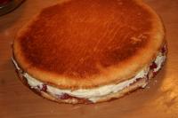 Spread the cream on the cake base with jam and...
