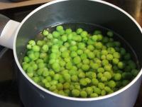 Cook peas until tender. Drain and add into the...
