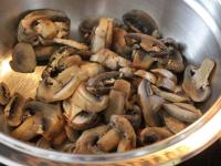 Sauté the mushrooms in a little oil in a covered...