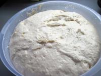Knead the dough and let it rise covered in a warm...