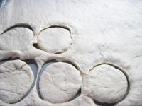 Tip out the risen dough onto a floured board and...